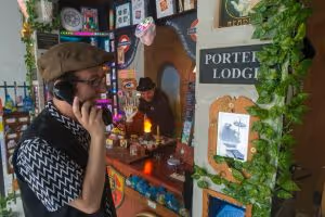 Picture of Michael Brown and Matthew Taylor in front of the Porters' Lodge at Lockhouse escape games