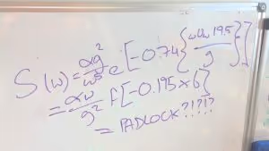 A whiteboard covered in maths equations equally PADLOCK?????
