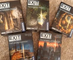 a selection of five exit games in their boxes