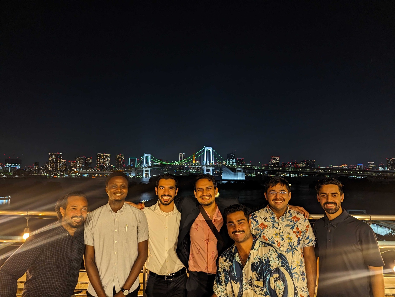 A child in a pink knit hat drinks from a glass of water, eyes closed, absorbing warmth from sunlight streaming in. The mood is peaceful and cozy.