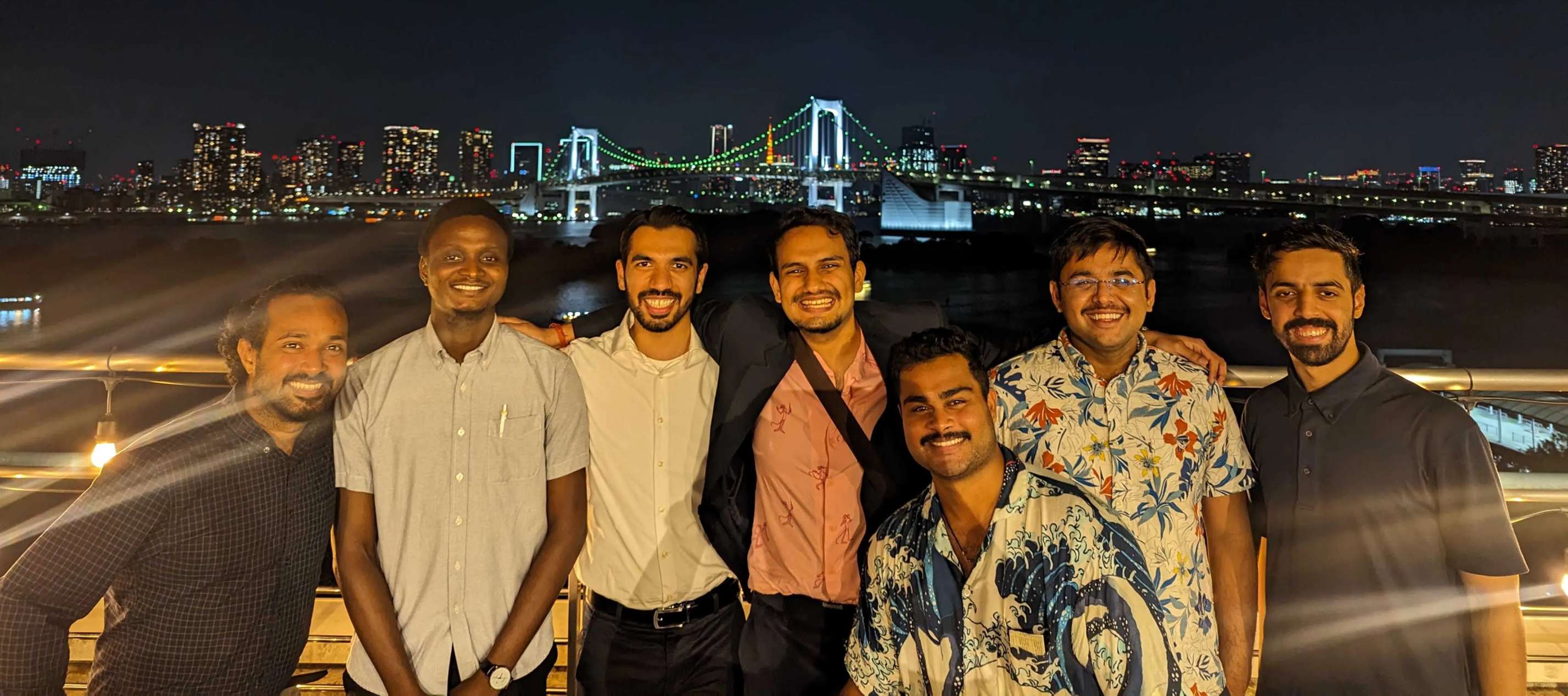 A child in a pink knit hat drinks from a glass of water, eyes closed, absorbing warmth from sunlight streaming in. The mood is peaceful and cozy.