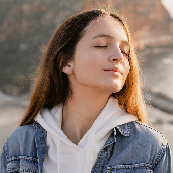 a woman with eyes closed