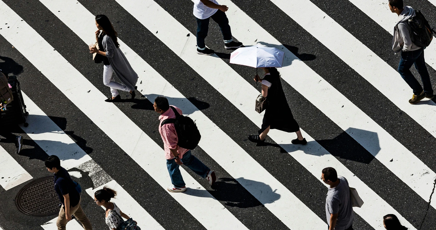people walking on a crosswalk
