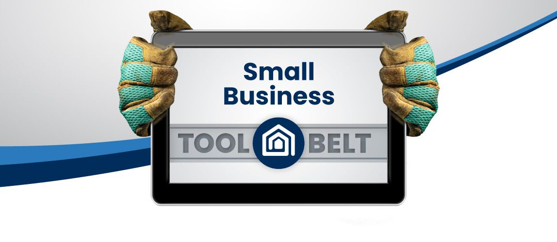 Gloved hands holding tablet displaying Small Business Tool Belt logo
