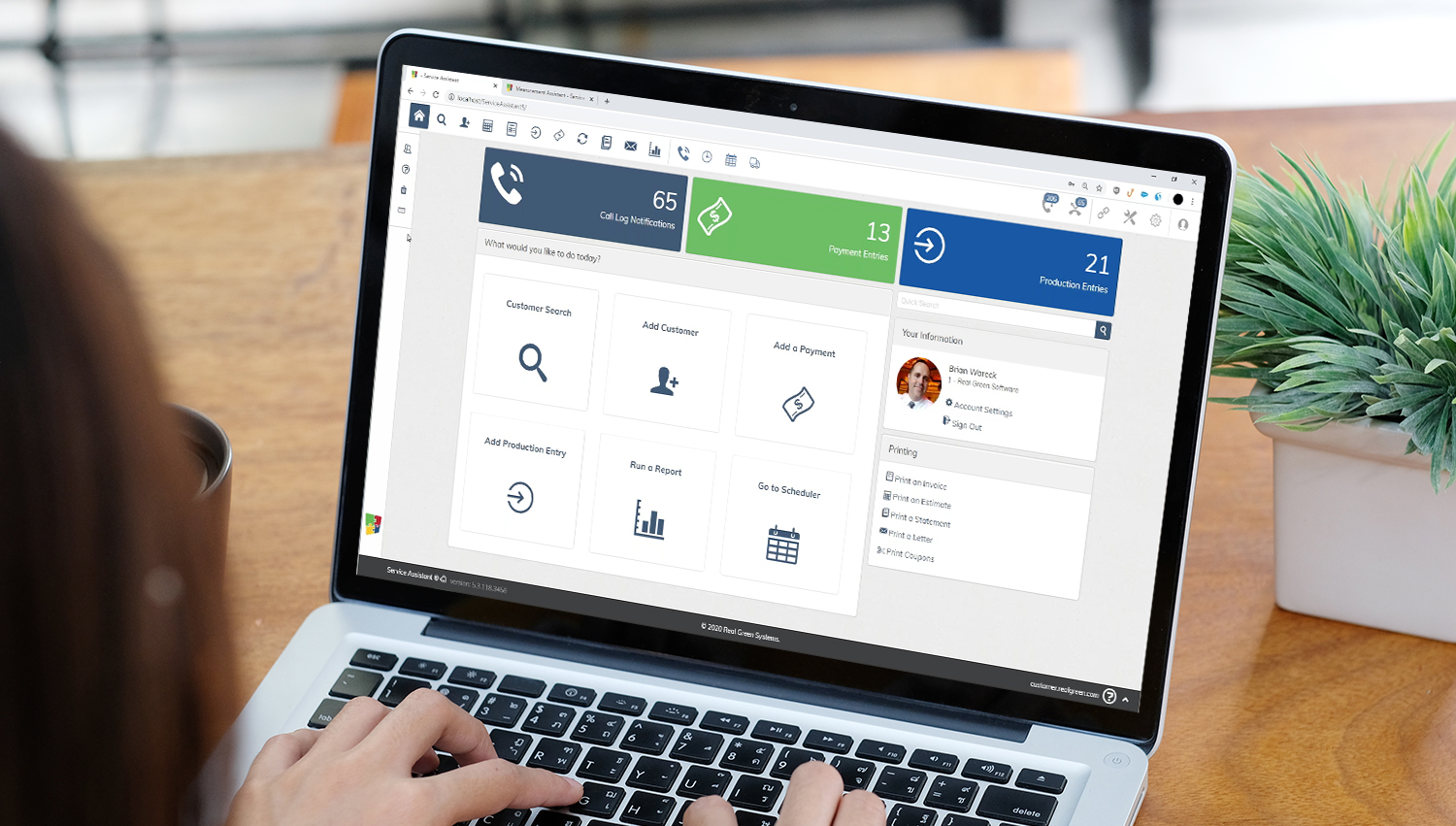 Business dashboard on laptop screen with various management functions