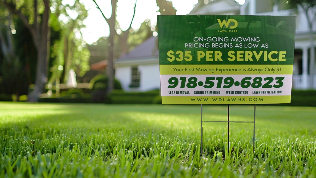 WD Lawn Care sign advertising mowing services on manicured green lawn