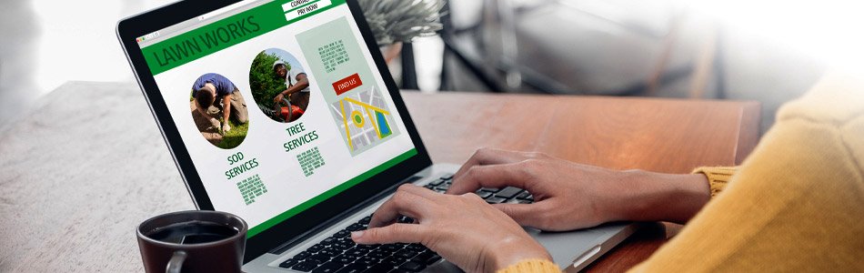 Person browsing landscaping website with tree services on laptop