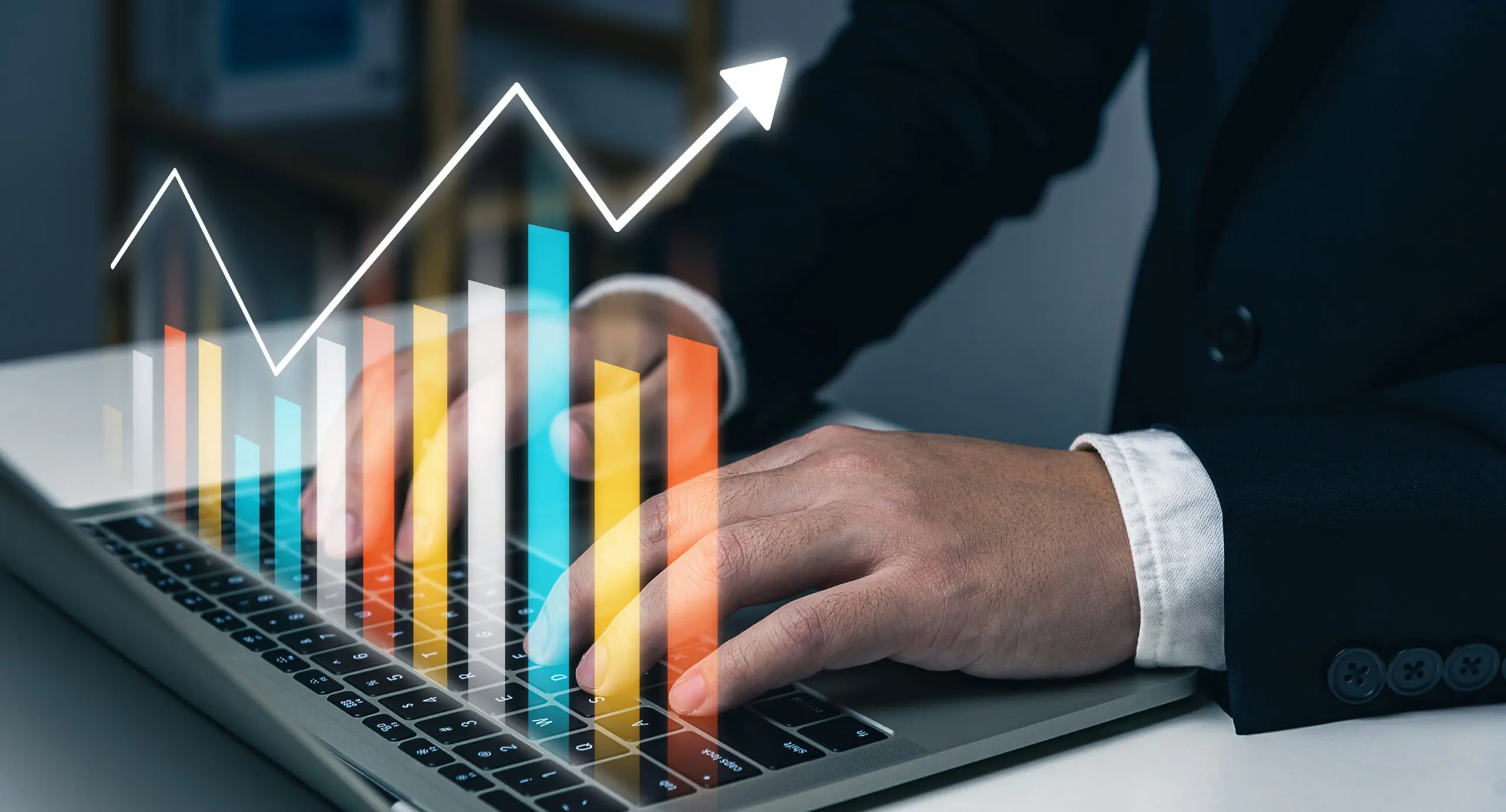 Colorful bar graph showing growth trend on laptop screen