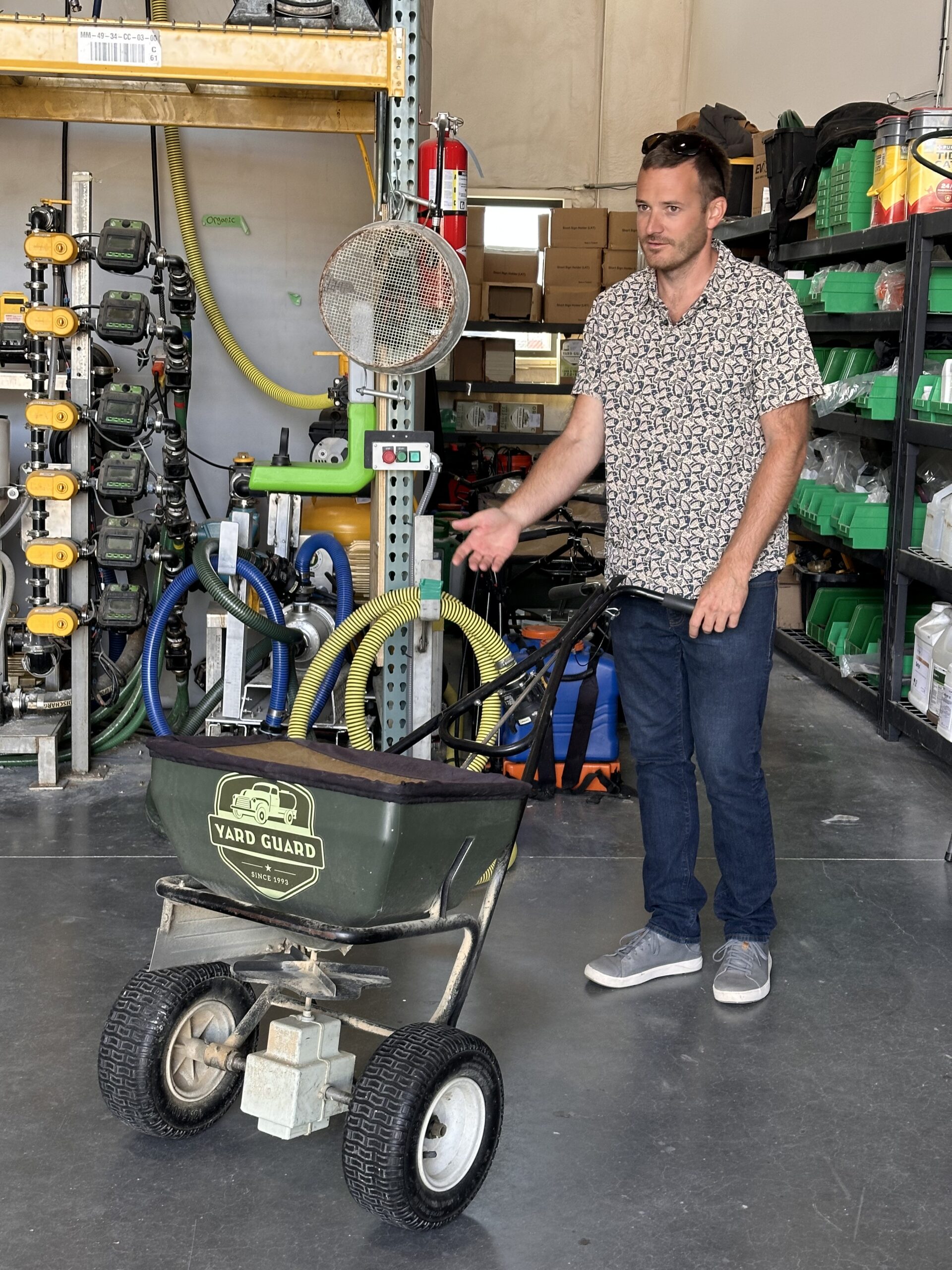 Yard Guard lawn equipment in warehouse with industrial shelving and equipment