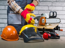 Construction safety gear with hard hats, gloves, and protective equipment