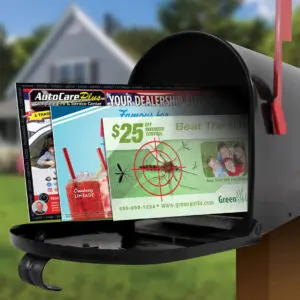 Open black mailbox with automotive advertisement and promotional flyer