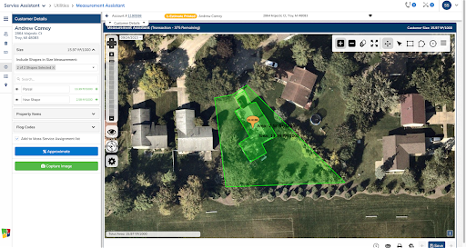 Aerial view of residential properties with a highlighted green property plot