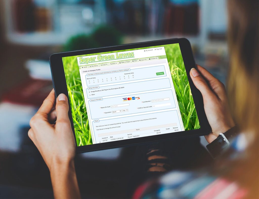 Person using tablet to access Super Green Lawns online service form