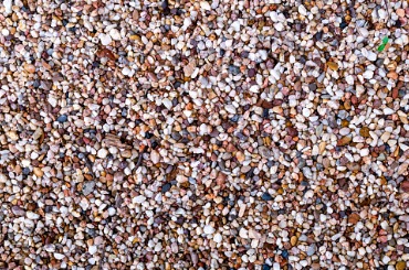 Closeup of small, multicolored pebbles tightly packed together