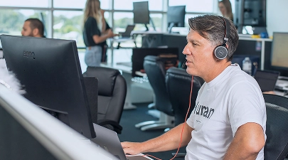 Photo of a person in front of their computer