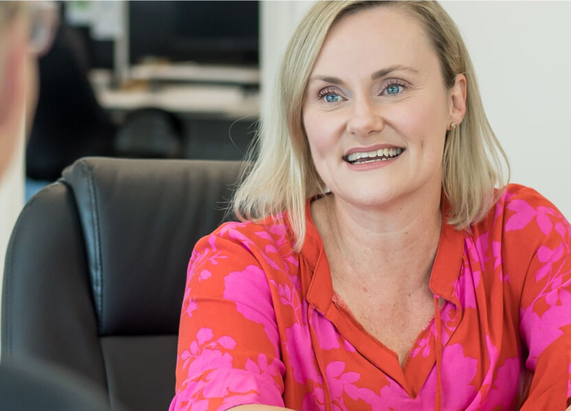 Woman talking to team member