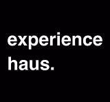 White text saying 'experience haus.' on a black background.