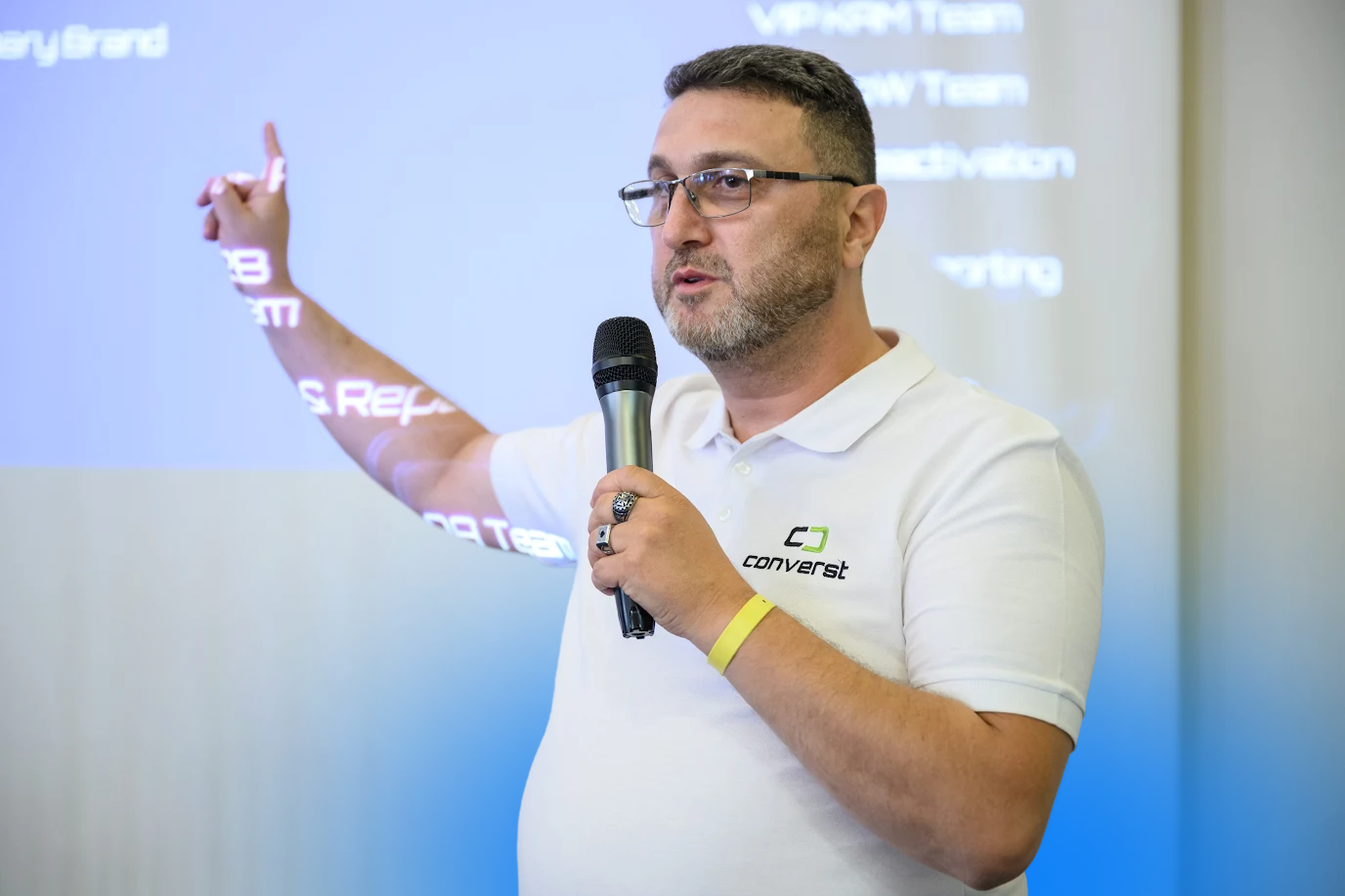 Converst team member presenting to colleagues during the company team-building event