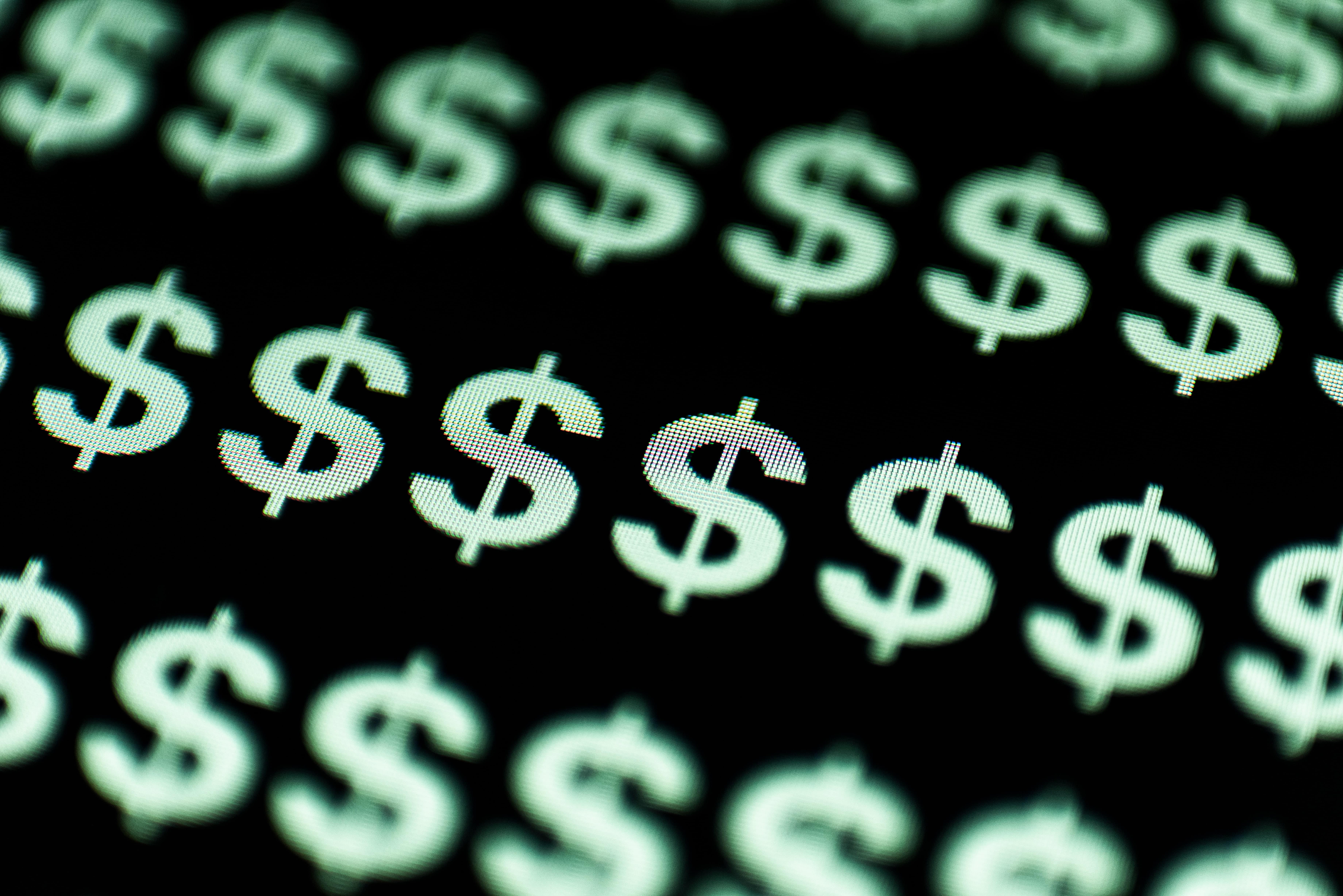 Green dollar signs scattered on a dark background