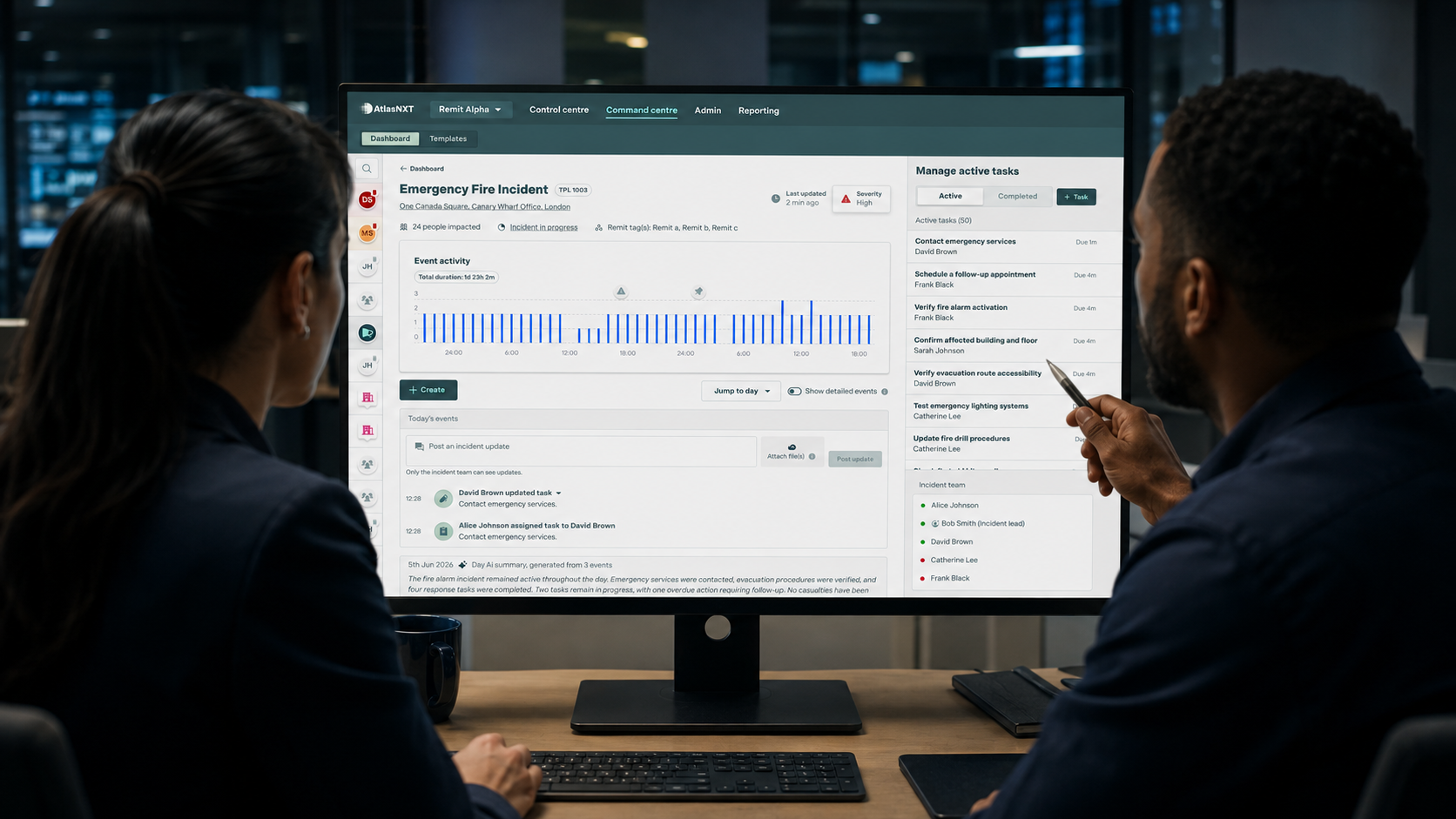 Two incident response professionals reviewing the AtlasNXT Incident Room interface