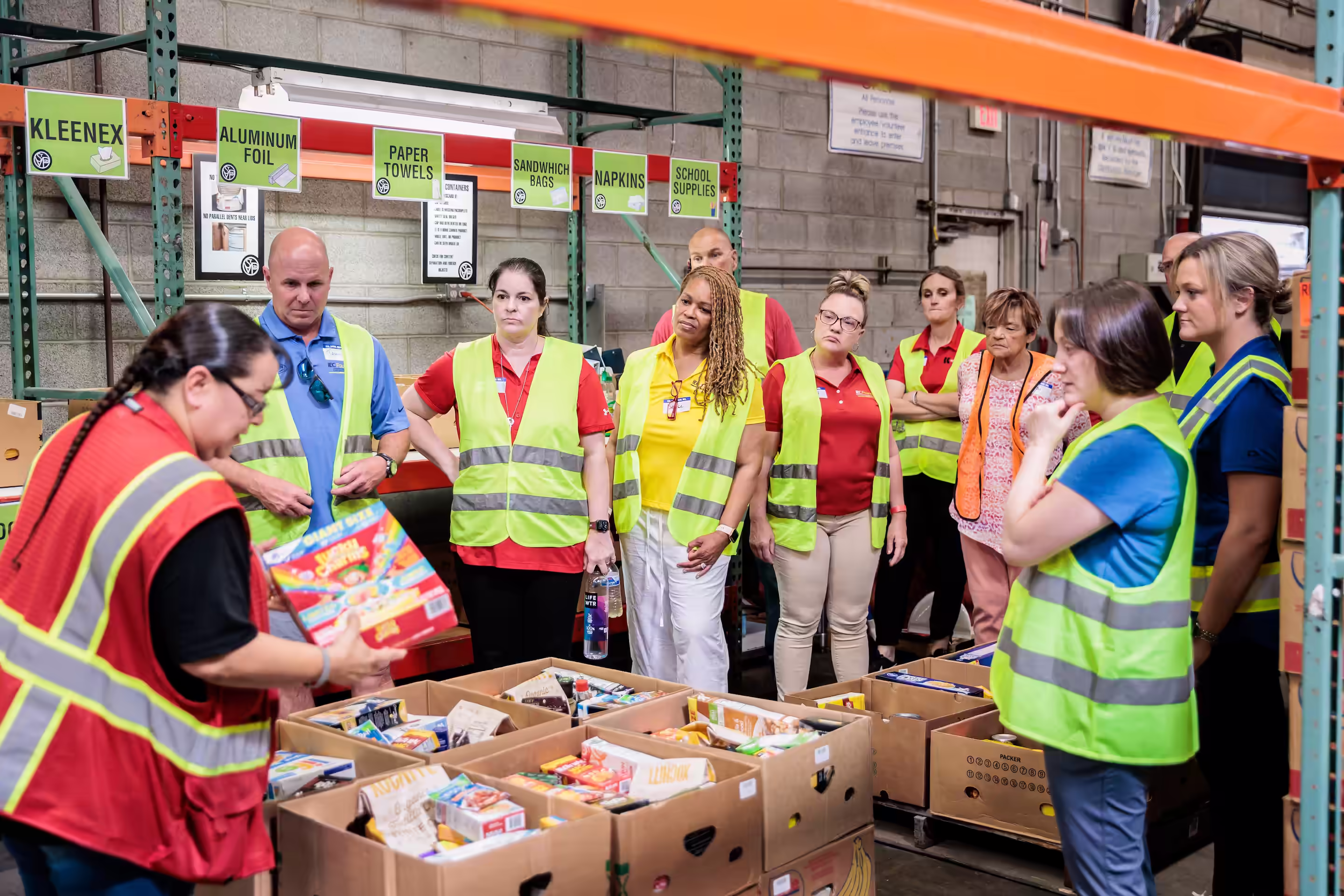 IEC Foundation team sorting food donations, volunteering at St. Vincent DePaul