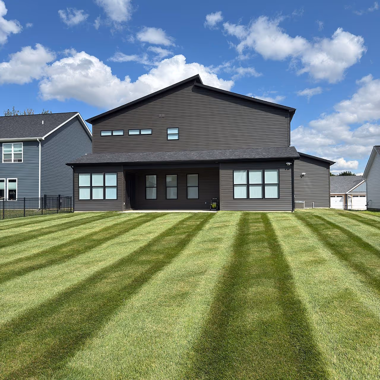 Freshly mowed striped lawn with professional finish