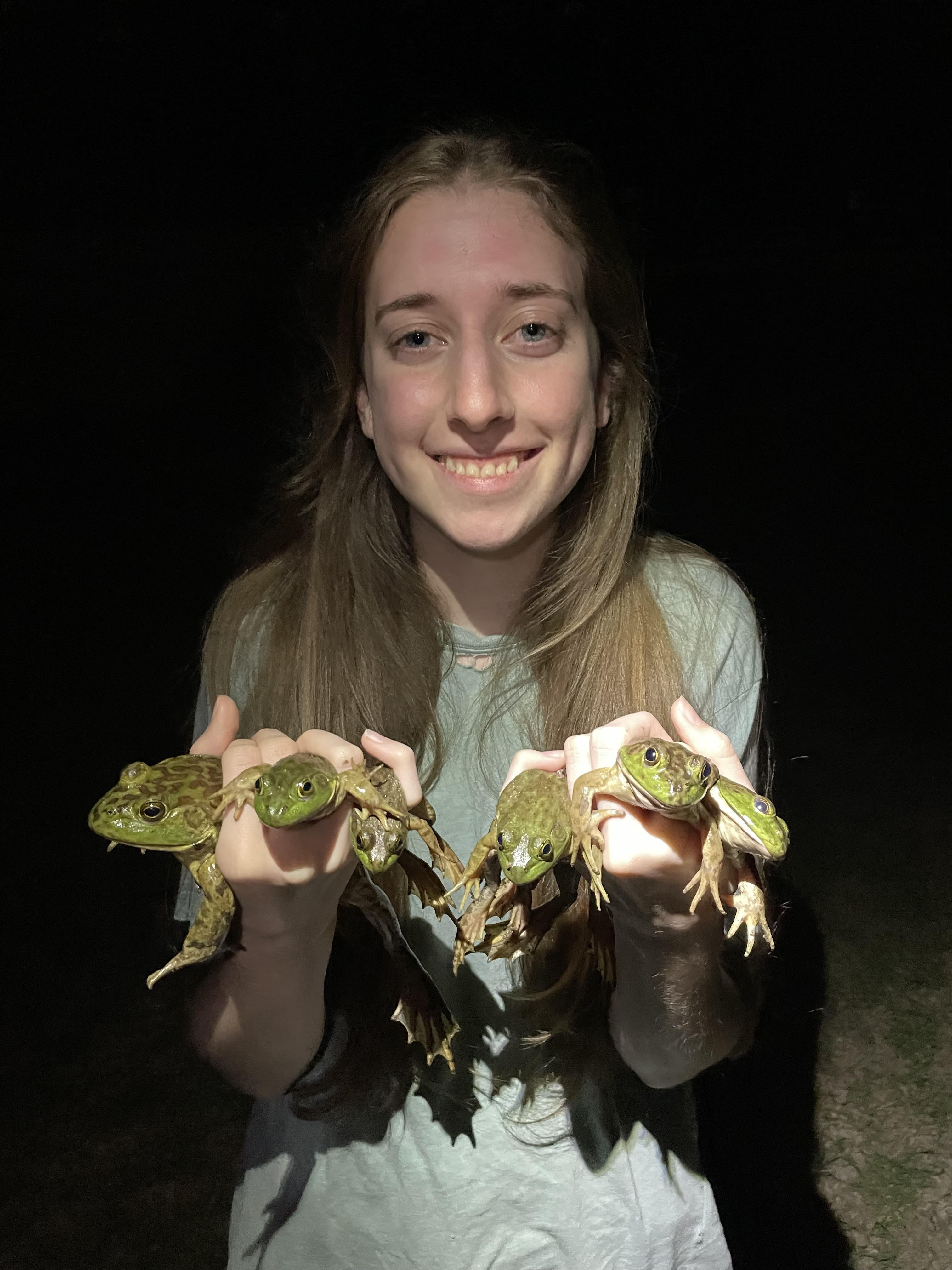 Karly rolling up her sleeves and smiling
