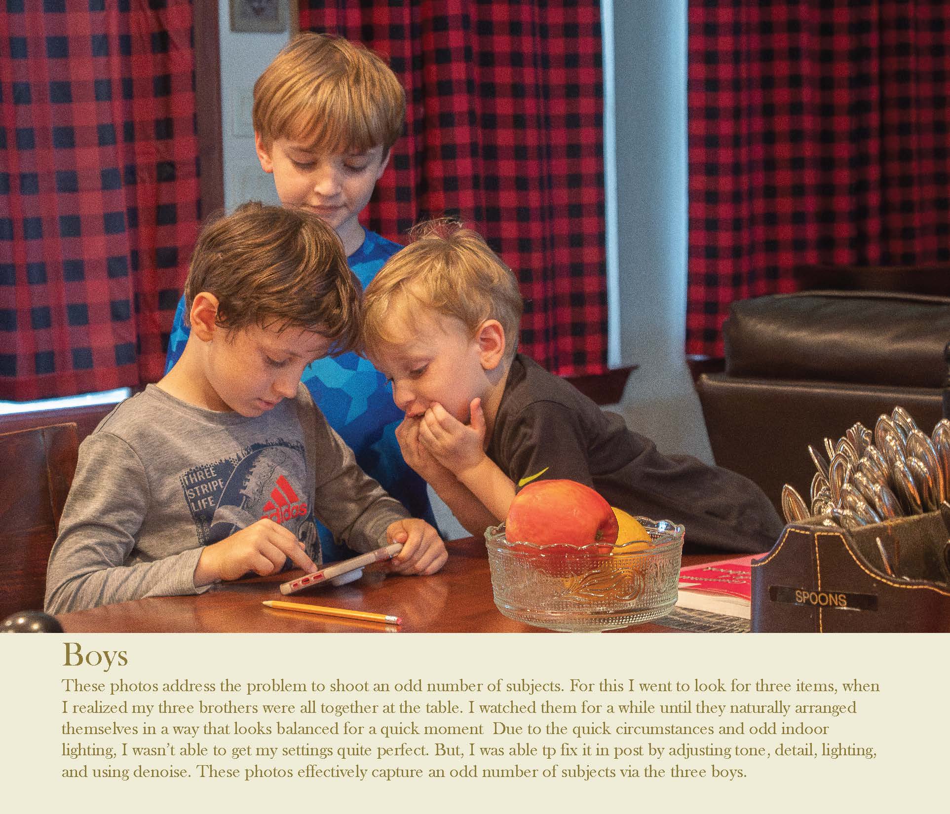 three boys huddled around a phone