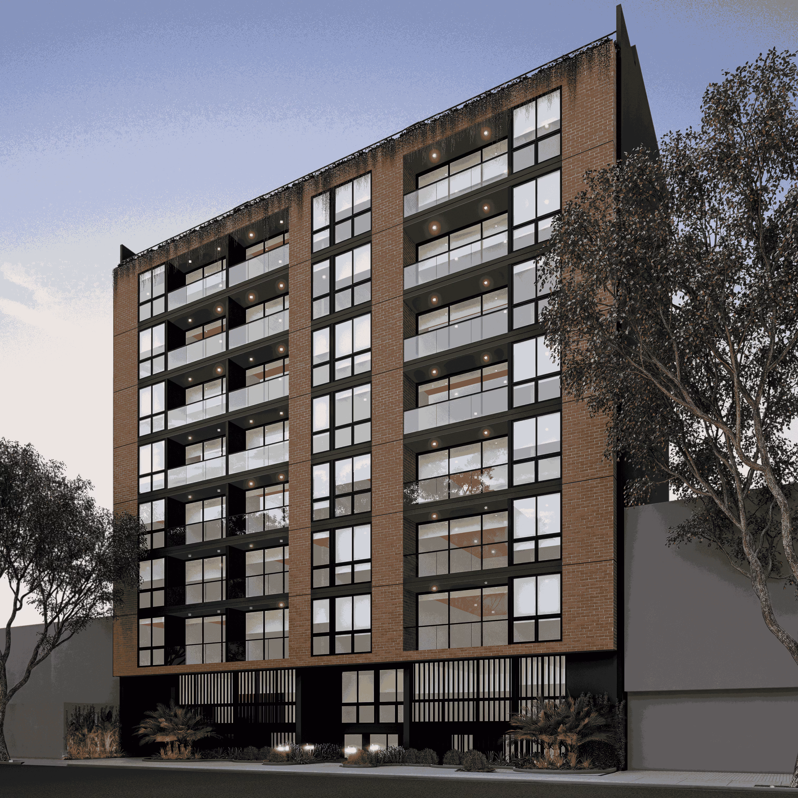 Edificio moderno de varios pisos con fachada de ladrillo, grandes ventanas, balcones con barandales de vidrio y árboles a los lados.