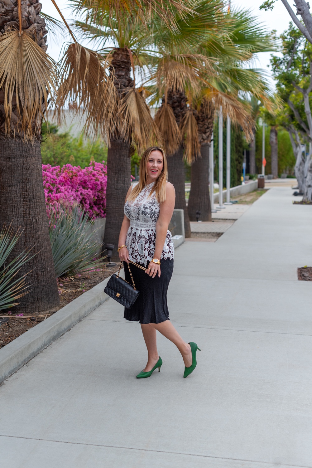 wear from work to happy hour 3 | What to Wear by popular LA fashion blog, Posh in Progress: image of a woman wearing a white lace top, black skirt gold watch, gold link bracelet, green heels, and black quilted Chanel bag. 