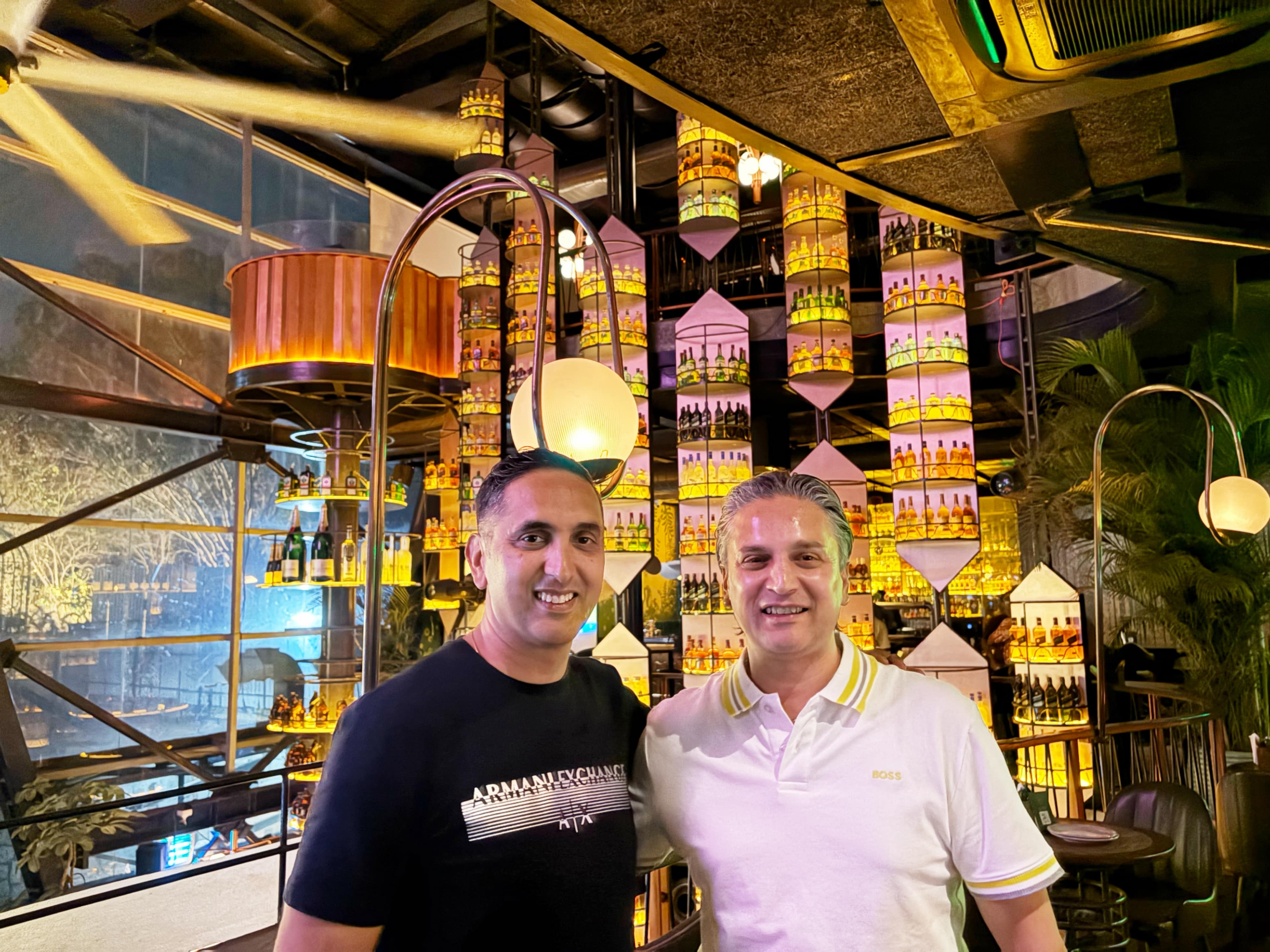 Abstract view of a large event space with blue digital theme, representing innovation and corporate gatherings.