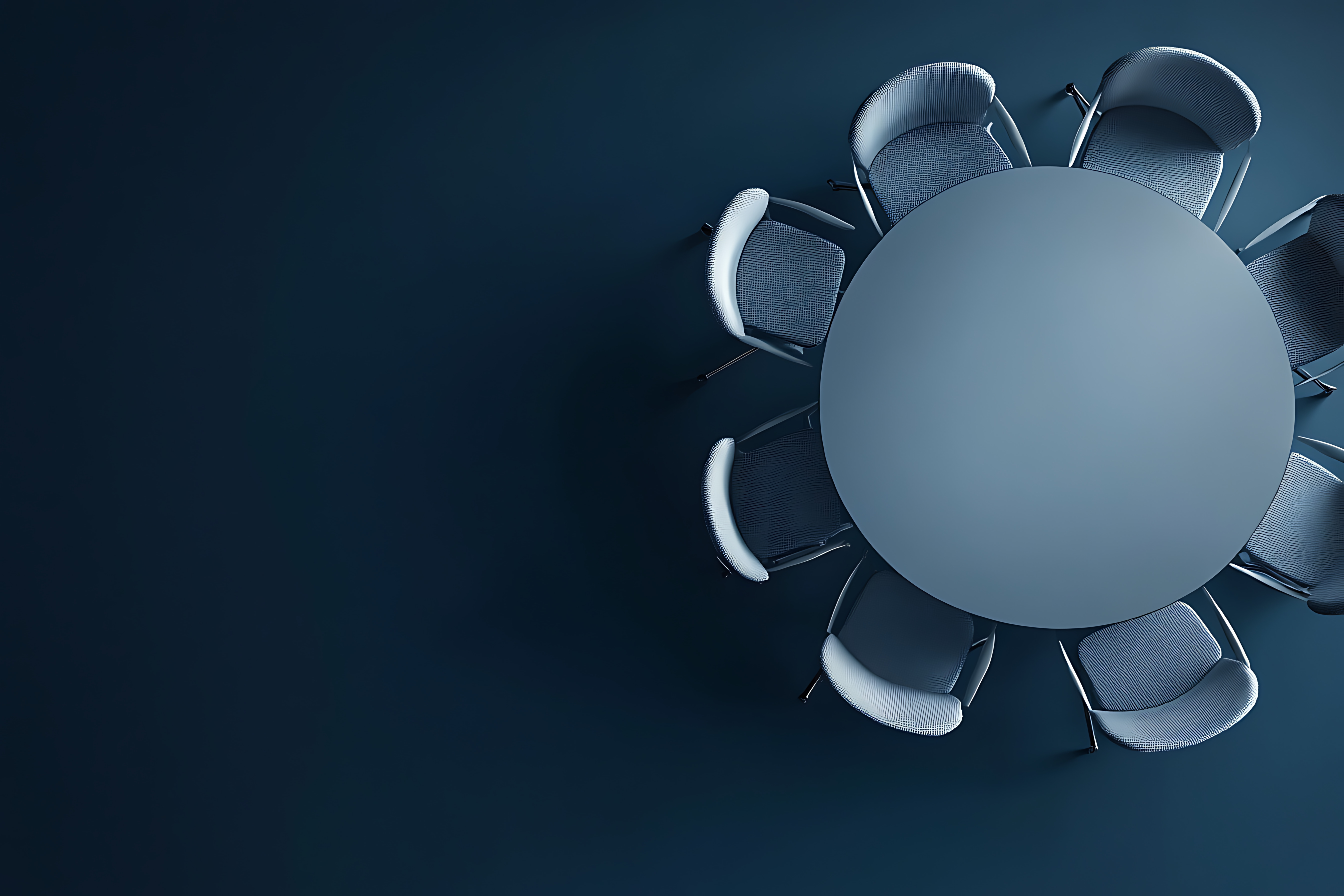 A top-down view of a sleek round conference table with empty chairs, symbolizing executive collaboration, the convergence of diverse ideas, and the structured environment required for high-level strategic decision-making.