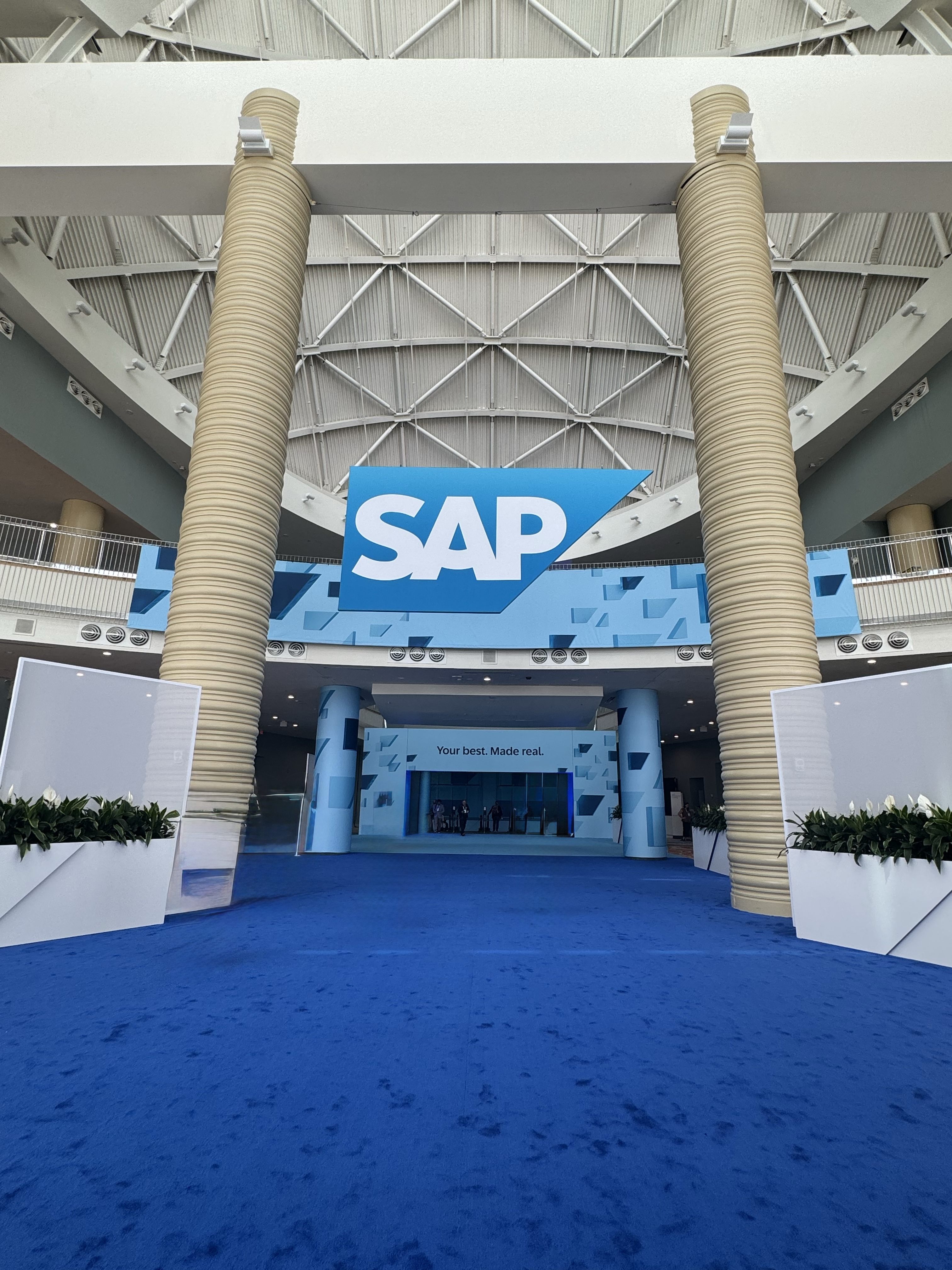 Ashish standing in from of a banner named do your best in the professional conference room
