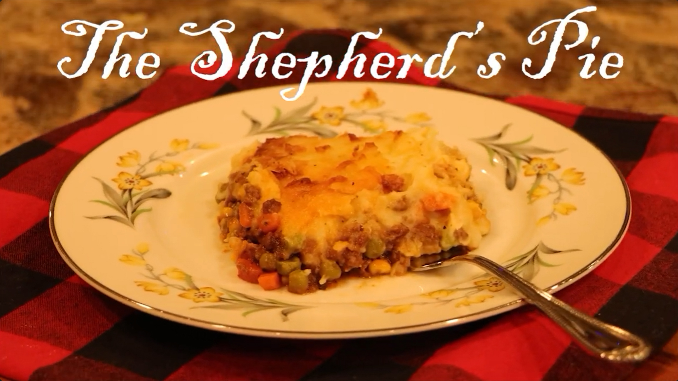 Screenshot of a video called the shepherd's pie, filmed by Bryndon. Shepherd's pie on a plate with the title "The Shepherd's Pie" above it.