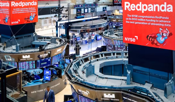 Redpanda IPO at New York Stock Exchange trading floor with digital displays
