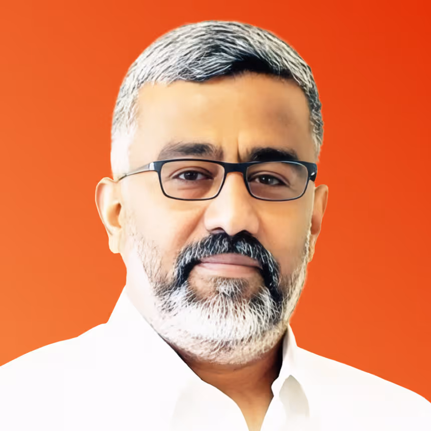 Middle-aged man with glasses and gray hair in white shirt