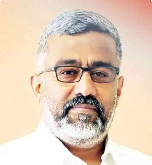 Middle-aged man with glasses and gray hair in white shirt