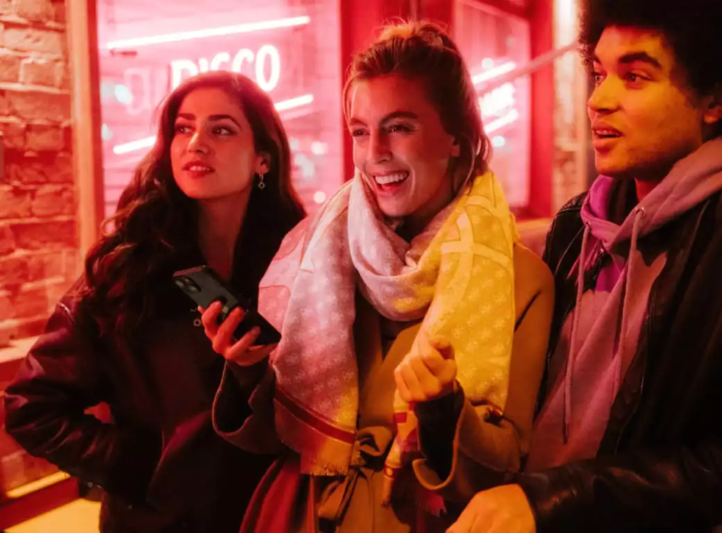 A group of friends enjoying a spontaneous night out, made possible by using Ambl to find and book a great venue.