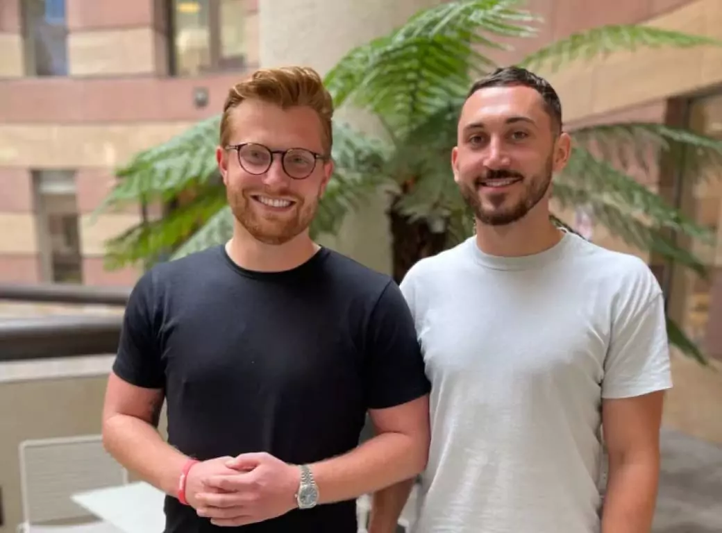 Ambl co-founders standing together, celebrating their mission to revolutionize last-minute bookings.