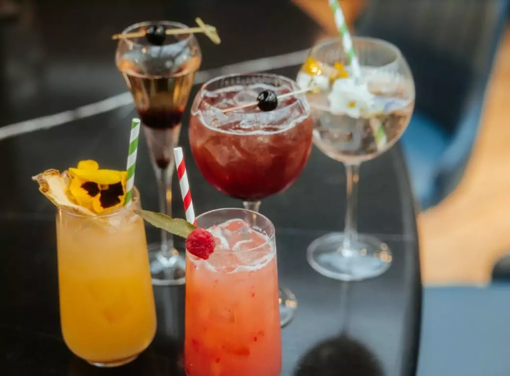 A selection of vibrant cocktails served at an Ambl-partnered bar, showcasing the exciting nightlife experiences available through the Ambl app.