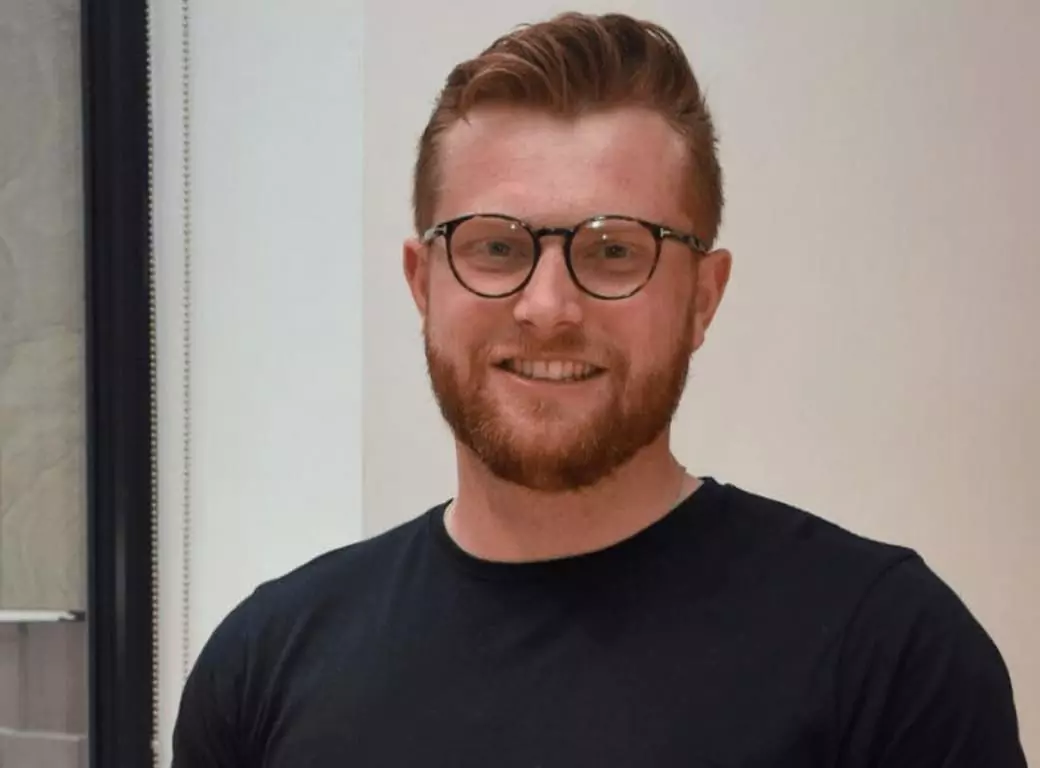 Aaron Solomon, an Ambl team member smiling, representing the passion behind the app that connects users with venues in real time.