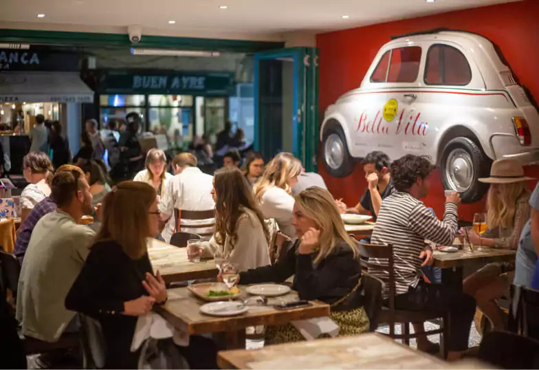 A vibrant Italian eatery with a lively atmosphere and rustic decor at Bella Vita. Find cozy spots like this with Ambl.