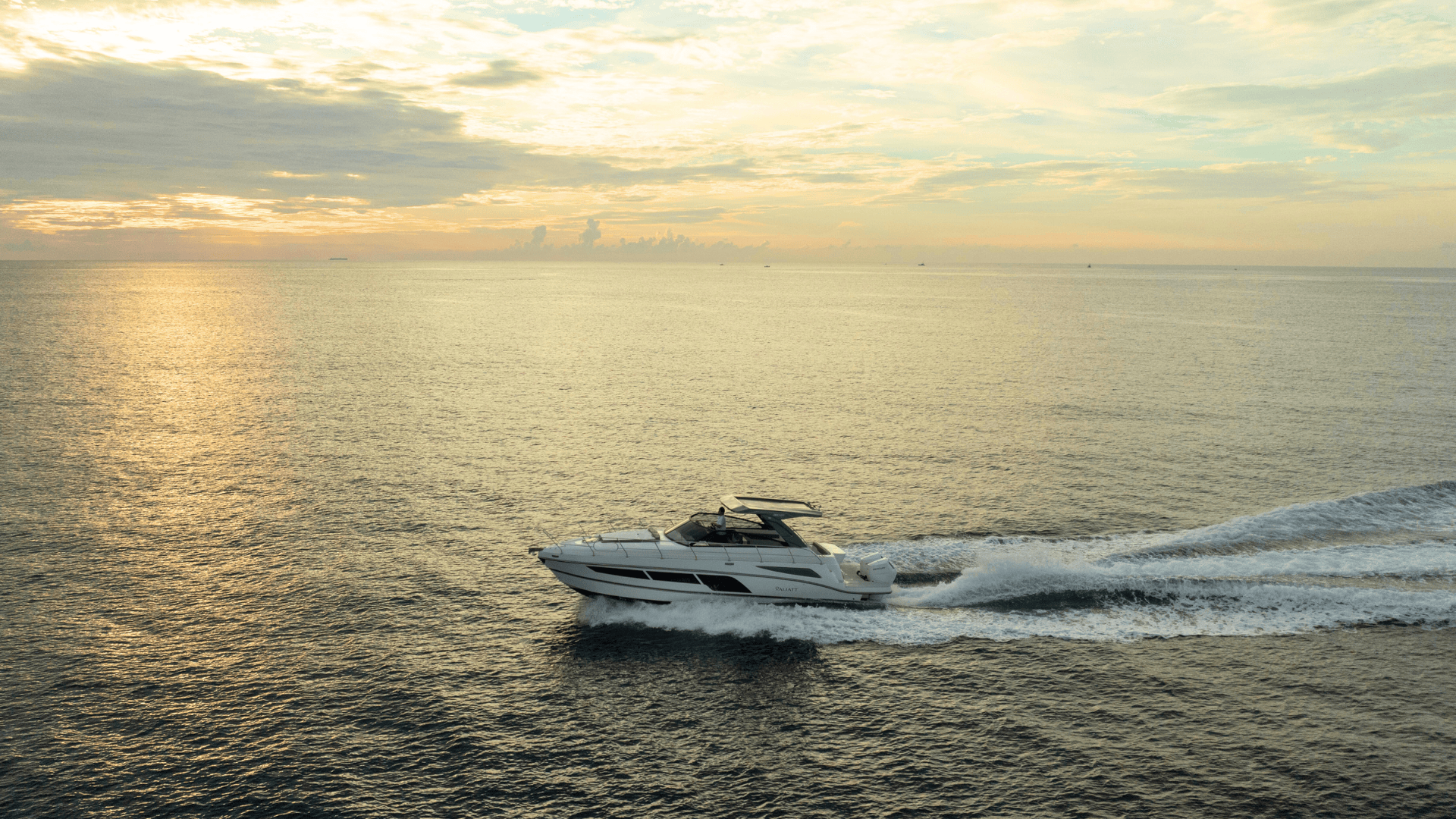 Valiatt luxury yacht navigating calm waters at sunset