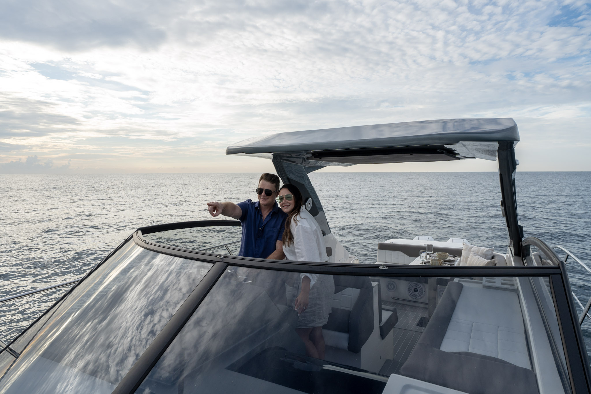 Couple enjoying the cockpit of a Valiatt luxury yacht at sea