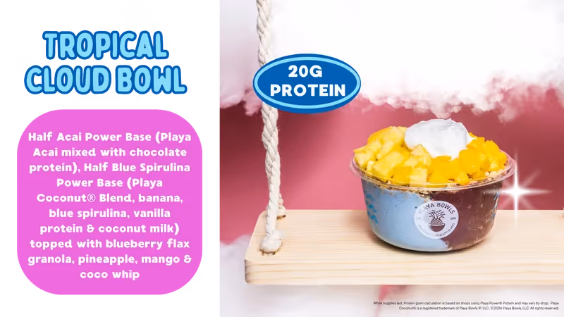 A colorful smoothie bowl featuring acai, banana, blue spirulina, topped with granola, pineapple, mango, and coconut whip.