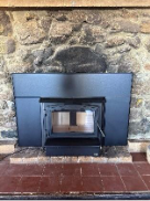 A fireplace in a roomAI-generated content may be incorrect.