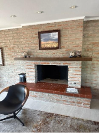 A fireplace in a roomAI-generated content may be incorrect.