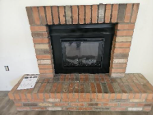 A fireplace with a glass doorAI-generated content may be incorrect.