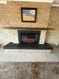 A fireplace in a roomAI-generated content may be incorrect.