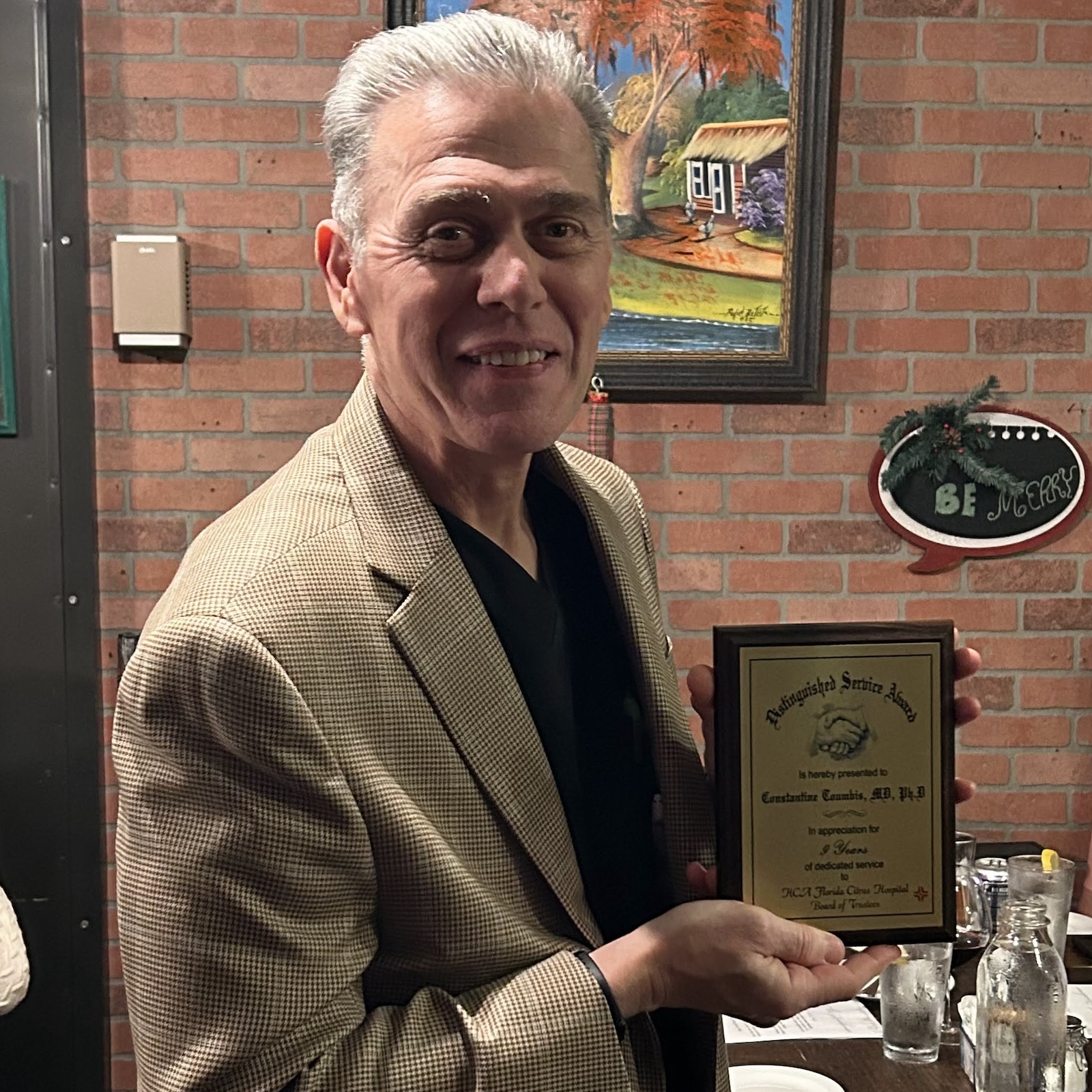 Constantine Toumbis receiving award